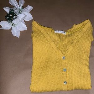 Yellow long sleeved shirt